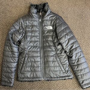 Girls north face jacket gently used. Black with fur lining size 7/8 (S)